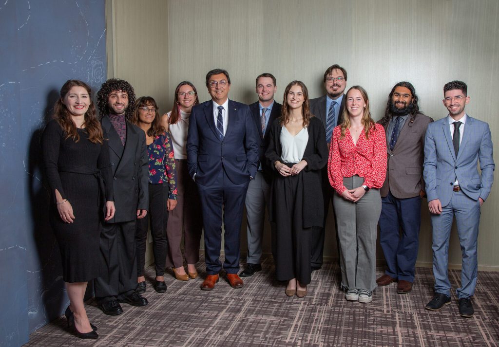 David Naylor (centre) with all the Naylor Fellows who are currently attending U of T, celebrating at the Naylor Fellows dinner on Oct. 18, 2023 in Toronto.