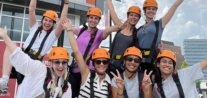 KPE's Safe Sport research lab taking a break from the ISSA conference in Ottawa to zip-line over the Ottawa river. Top Row: Raiya Taha Thomure, Ashley Stirling, Sarah McGee, Sophie Wensel; Bottom Row: Jatta Muhonen, Francesca Principe, Anika Taylor, Aalaya Milne